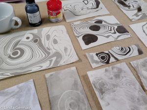 Marbling paper with alum and india ink