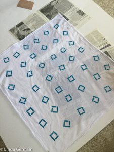 screen printed fabric with a paper stencil